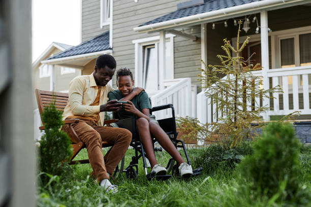 Caring Father with Son in Wheelchair