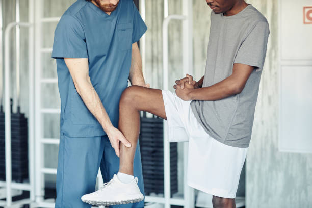 istock Doctor examining patient in gym 1434817283