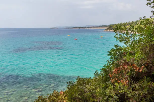 Photo of Akti Koviou beach on Sithonia peninsula, Chalkidiki, Greece. Summer vacation travel holiday background concept.