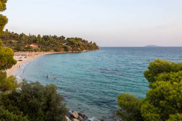 Photo of Akti Koviou beach on Sithonia peninsula, Chalkidiki, Greece. Summer vacation travel holiday background concept.