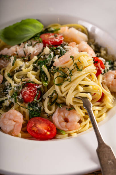 Fresh pasta linguine with shrimp and tomatoes
