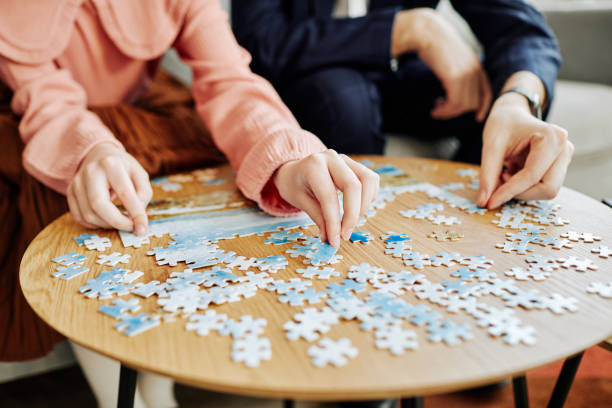 istock Family Doing Puzzles Closeup 1434820217