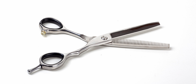 a new scissors on white in the hair salon