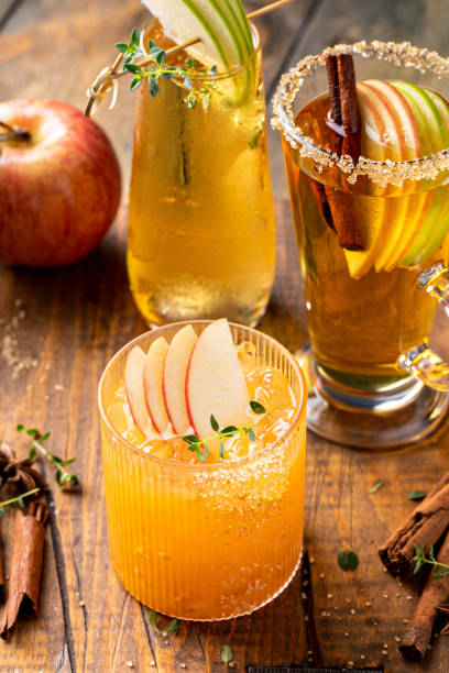 Variety of fall cocktails or mocktails made with apple cider stock photo