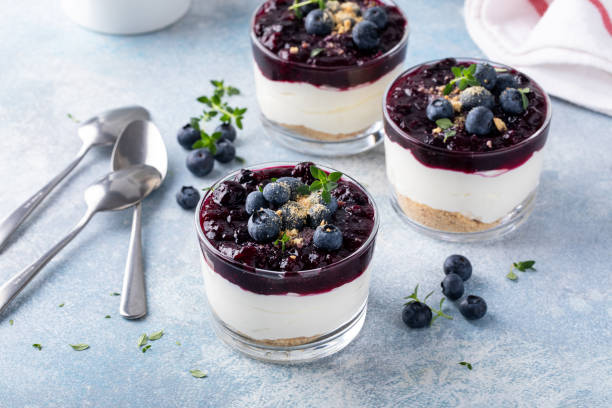 istock Blueberry cheesecake in a jar with graham cracker base 1434821066