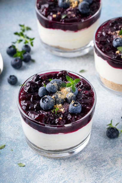 Blueberry cheesecake in a jar with graham cracker base