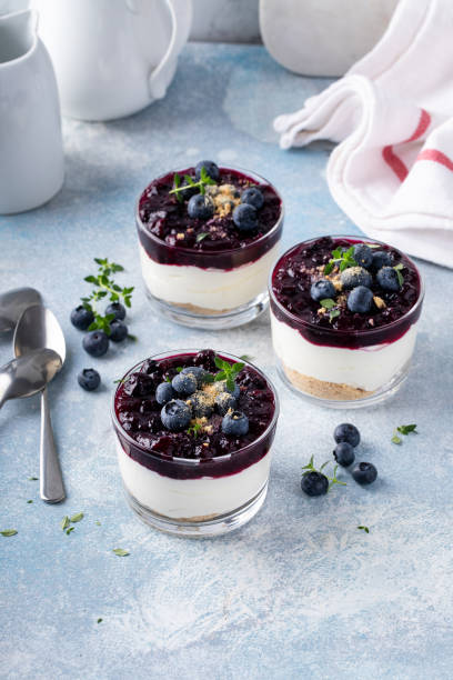istock Blueberry cheesecake in a jar with graham cracker base 1434821075