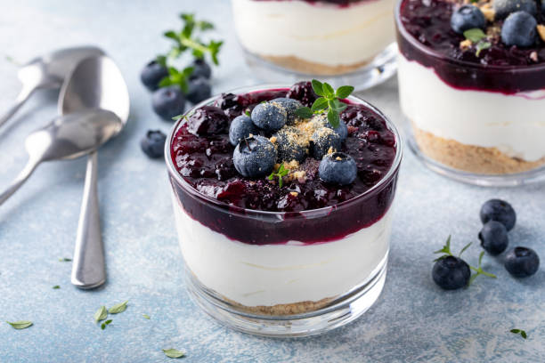 istock Blueberry cheesecake in a jar with graham cracker base 1434821079