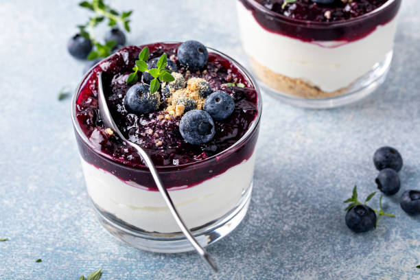 istock Blueberry cheesecake in a jar with graham cracker base 1434821081
