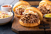 Pulled pork sandwiches with cole slaw on brioche buns