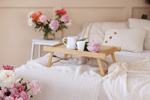 Bouquet of fresh flowers in a home light modern interior. Fresh flowers in the morning in the bedroom.