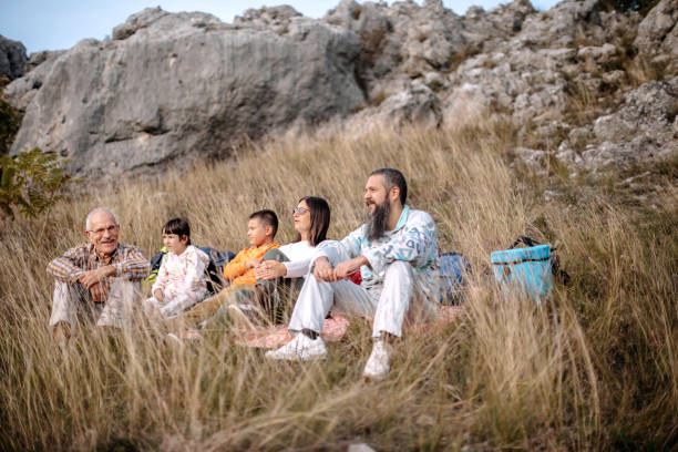 istock Multi-generation family in nature camping and taking a break 1434827886
