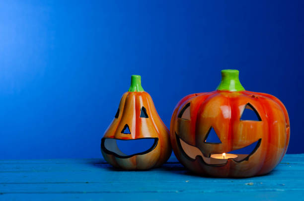 istock Halloween pumpkins on blue background 1434828249