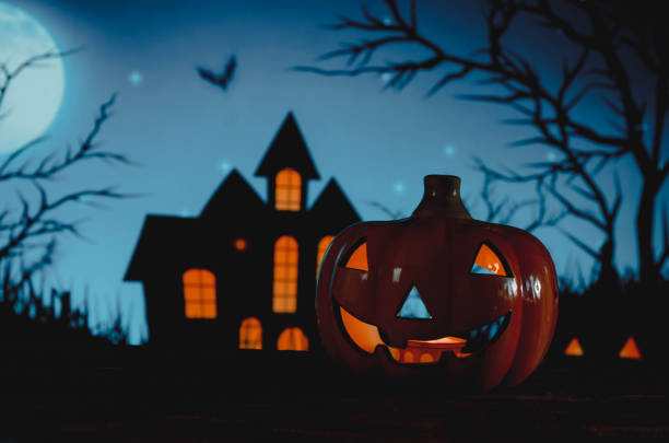 istock Halloween pumpkins on blue background 1434828390