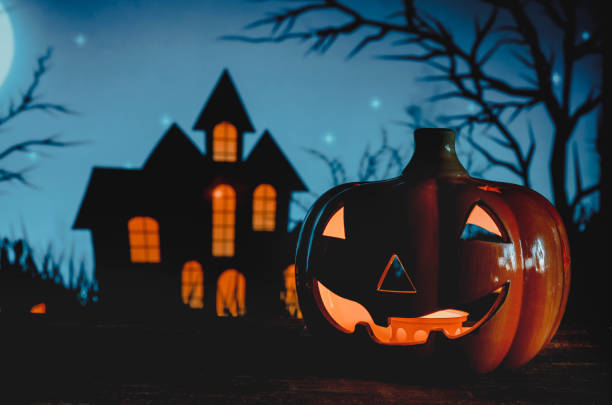 istock Halloween pumpkins on blue background 1434828398