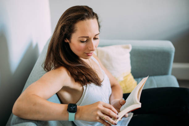 istock Young woman is reading book 1434828684