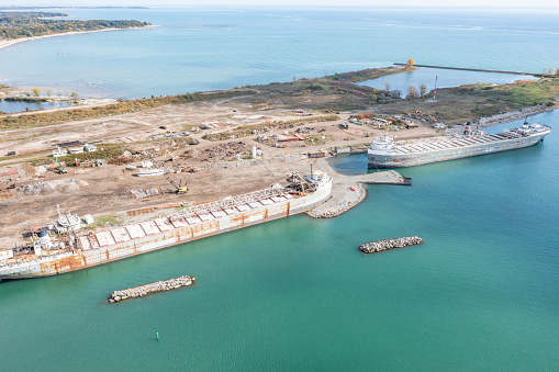 A large British harbour / port to allow ships to be anchored or to come in and drop off or load goods to be distributed across the world.