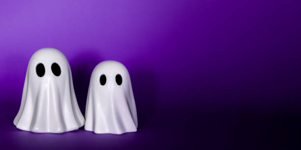 istock Two funny White Ghosts Halloween decor on a purple background 1434833853