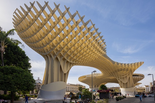 Seville, Spain – June 21, 2022: A low angle of Setas of Seville - wood construction of mushrooms  in downtown, Spain