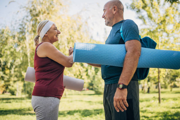 istock Yoga partners in park 1434836564