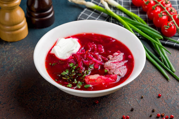 istock Borscht with sour cream and beef on stone table 1434836616