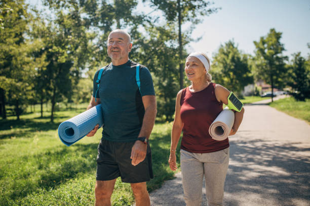 Mature couple going to exercise yoga
