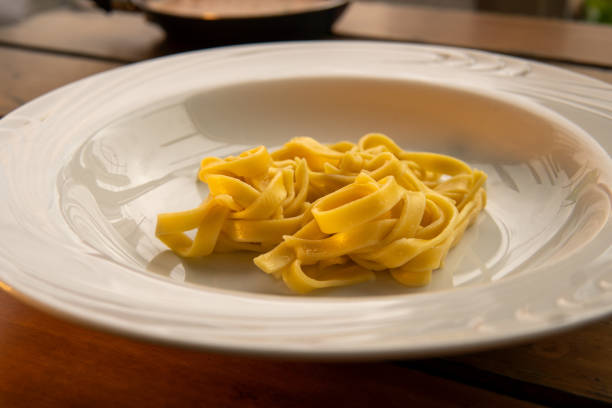 istock italian pasta served in white plate on wooden table 1434837066