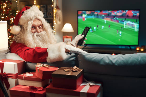 istock Happy Santa watching a soccer game 1434838674