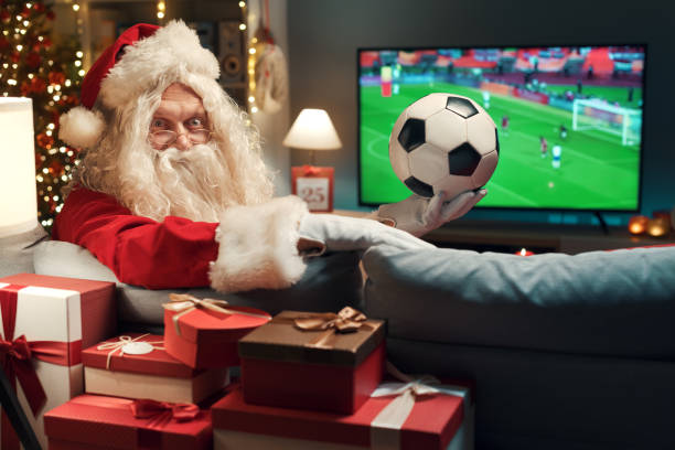 istock Happy Santa watching a soccer game 1434839432