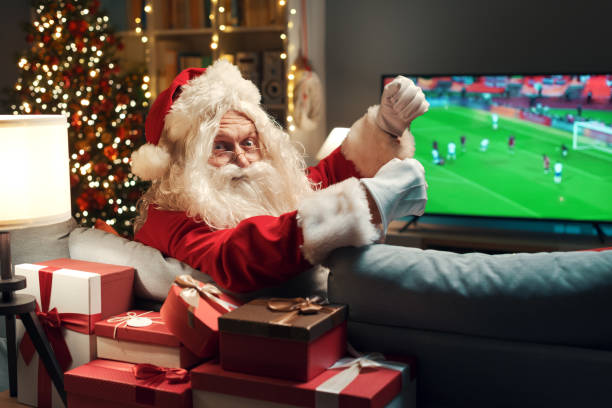 istock Happy Santa watching a soccer game 1434839550