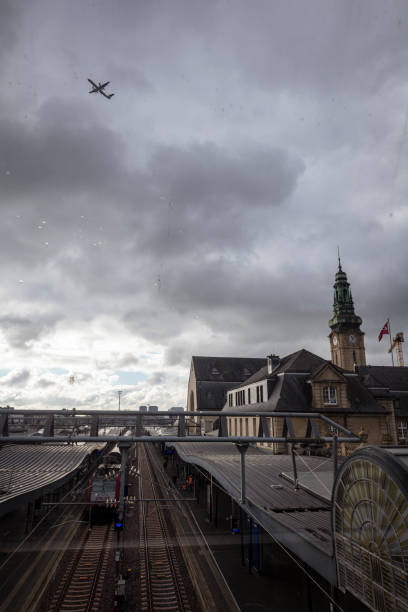 Luxembourg City, Luxembourg - November 22, 2021: A Luxair De Havilland Dash 8-400 flies over the train station in Luxembourg.