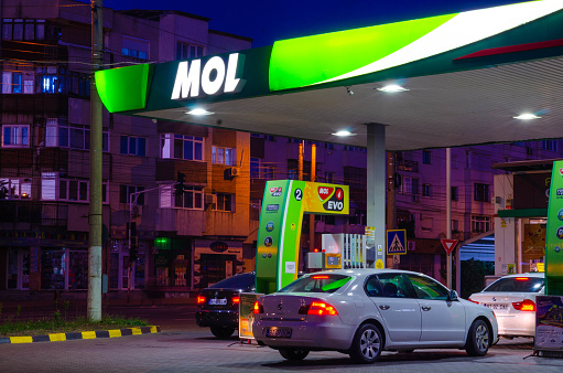 Bucharest, Romania - June 22, 2022: A Mol gas station is seen at night in Bucharest Editorial stock photo - stock image