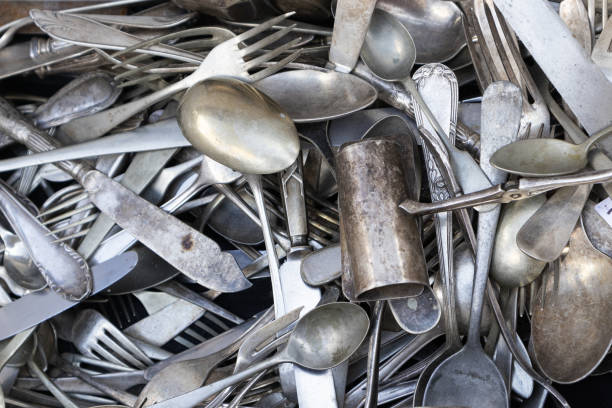 istock set of old silver cutlery piled up 1434843032