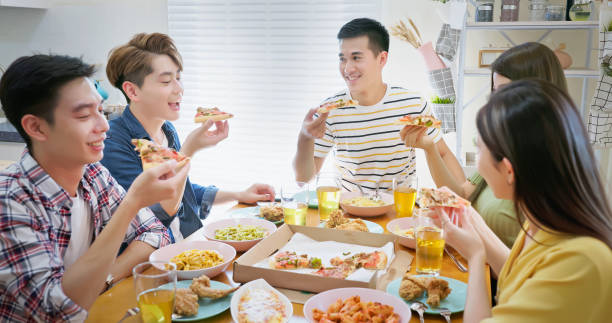 istock friends enjoying pizza 1434854463