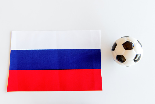 Soccer ball and Russian flag on white background
