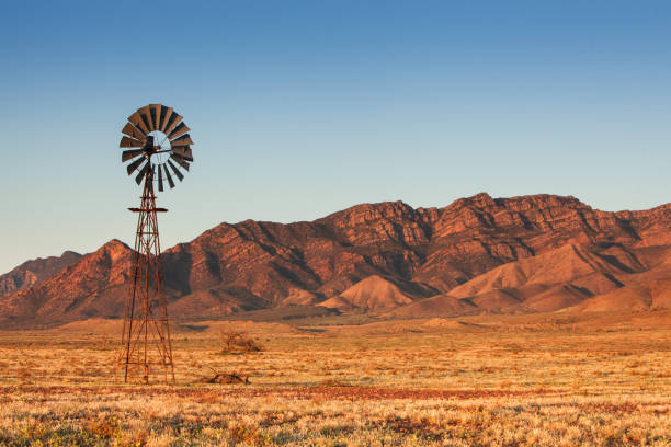 Lone Windmill Lone Windmill in the Flinders Ranges outback stock pictures, royalty-free photos & images