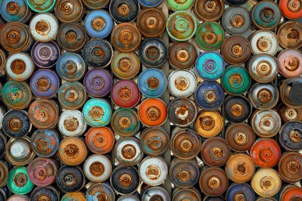 istock Graffiti spray cans lined up square side by side with view of spray head 1434857530