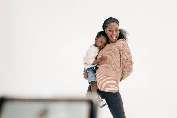 istock Pregnant mother playing with toddler son 1434861011
