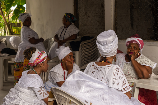 Saubara, Bahia, Brazil - June 12, 2020: CandomblÃ© members gathered in traditional clothing at the religious festival in Bom Jesus dos Pobre district, Saubara city.