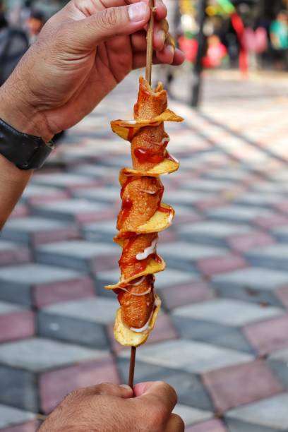 istock sausage with spiral potatoes 1434862242