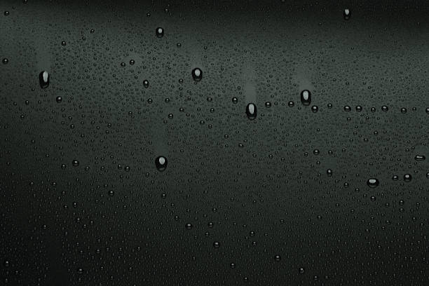 Water droplets on black background stock photo