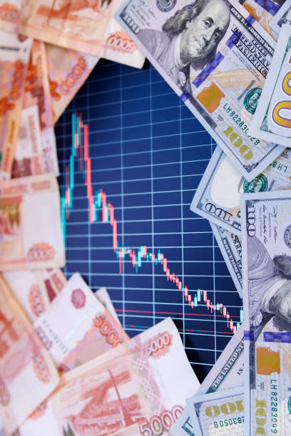 istock US dollar and russian ruble banknotes over digital screen with exchange chart, USD RUB depreciation concept 1434866467