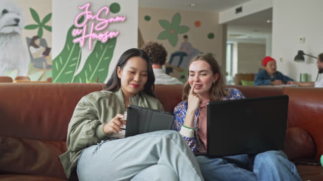 Two businesswomen working together in a modern office