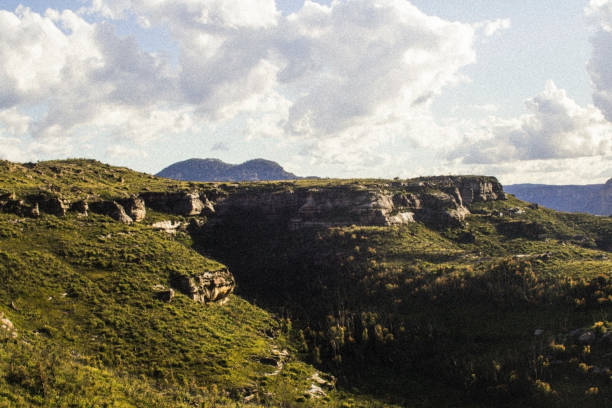 istock Green mountains with a blue sky and some clouds 1434869073