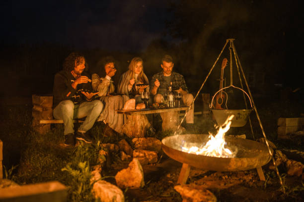 istock Mixed Race Friends Camping Together In Nature 1434873085