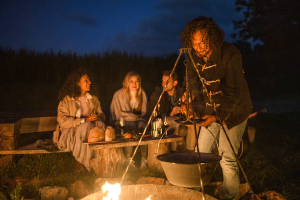 istock Mixed Race Friends Camping Together In Nature 1434873088