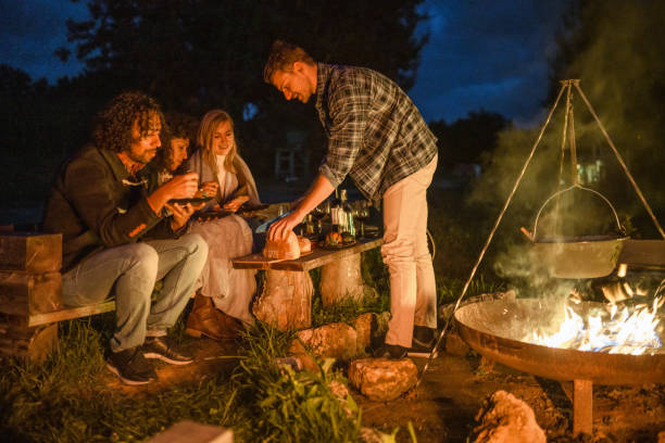istock Mixed Race Friends Camping Together In Nature 1434873098