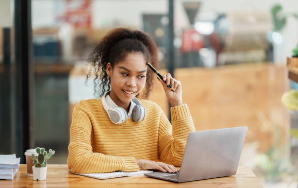 istock studentwoman working in a cafe 1434879739