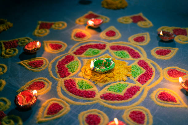 istock Happy Diwali - Diya lamps lit during diwali celebration 1434883577