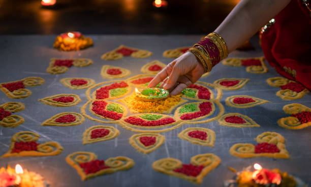 istock Happy Diwali - Diya lamps lit during diwali celebration 1434883579